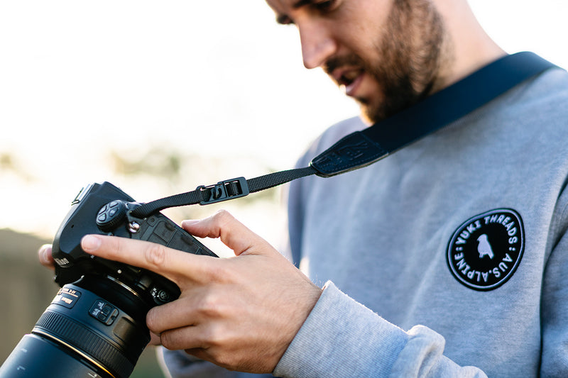 Male Photographer with Black Leather Camera Strap