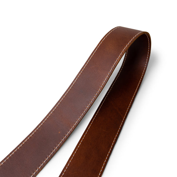Close up of classic brown leather camera strap by lucky straps