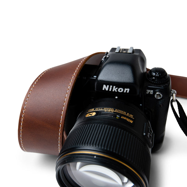 Classic Brown Leather Camera Strap with White Stitching for a retro camera