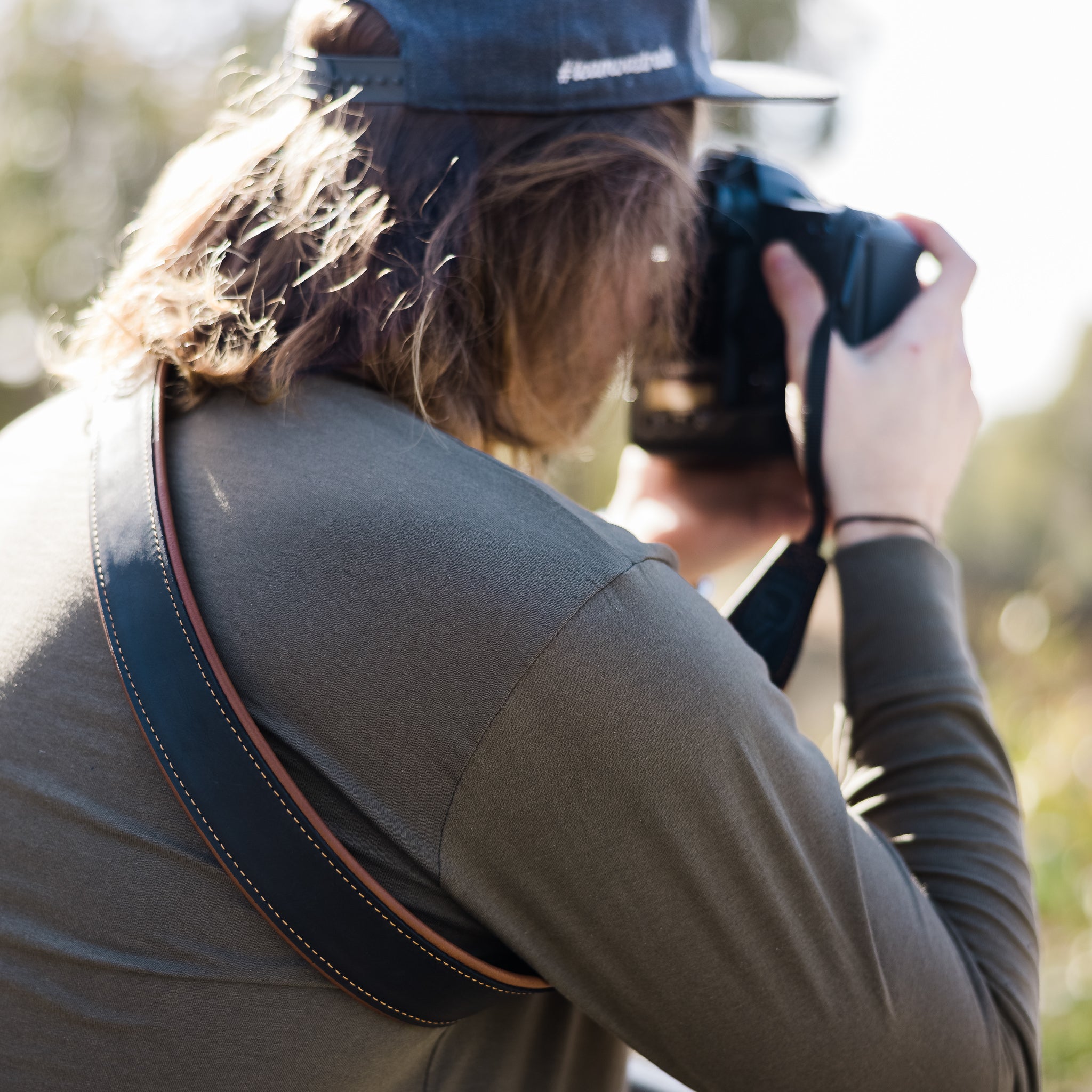 Photographer using Lucky Camera Straps Leather Strap in Black and Tan