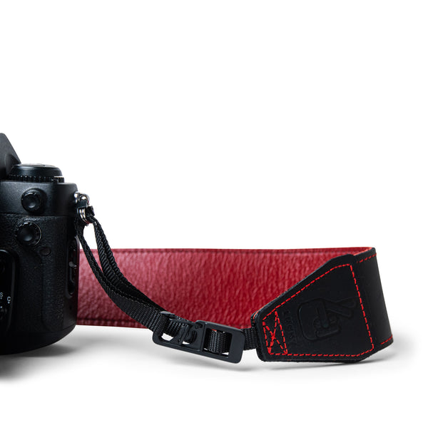 Close up of Lucky Straps quick release system on leather camera strap